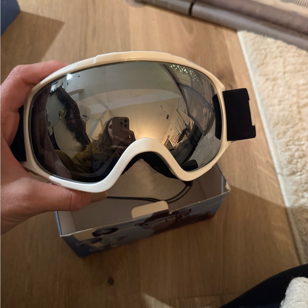 White ski goggles with Black Strap
